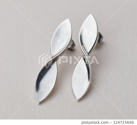 Unique earrings for women on a white background, promotional photo for an online vintage and handmade jewelry store Unique earrings for women on a white background, promotional photo for an online vintage and handmade jewelry store 124725689