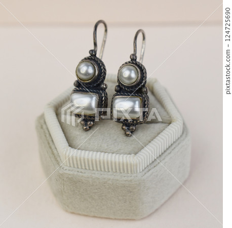 Unique earrings for women on a white background, promotional photo for an online vintage and handmade jewelry store 124725690