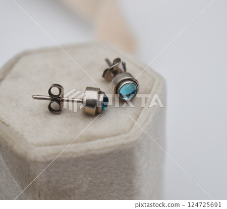 Unique earrings for women on a white background, promotional photo for an online vintage and handmade jewelry store Unique earrings for women on a white background, promotional photo for an online vintage and handmade jewelry store 124725691