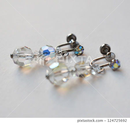 Unique earrings for women on a white background, promotional photo for an online vintage and handmade jewelry store Unique earrings for women on a white background, promotional photo for an online vintage and handmade jewelry store 124725692