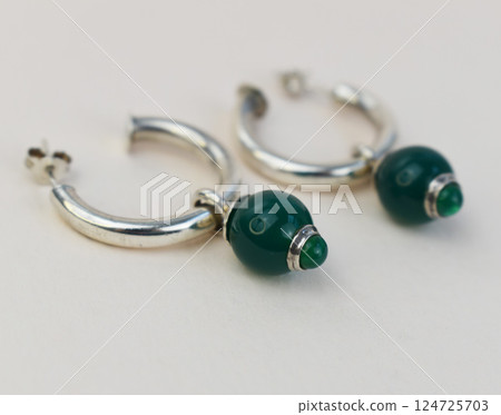 Unique earrings for women on a white background, promotional photo for an online vintage and handmade jewelry store Unique earrings for women on a white background, promotional photo for an online vintage and handmade jewelry store 124725703