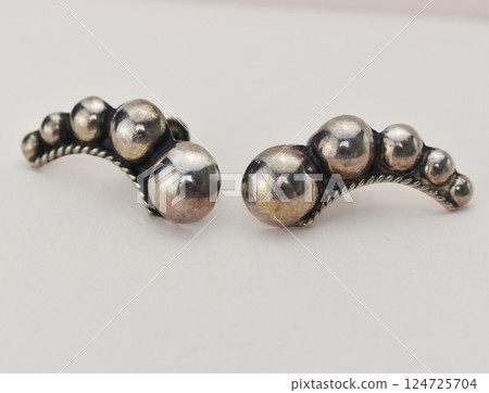 Unique earrings for women on a white background, promotional photo for an online vintage and handmade jewelry store Unique earrings for women on a white background, promotional photo for an online vintage and handmade jewelry store 124725704