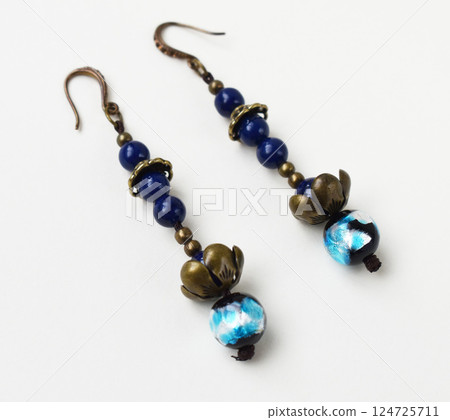 Unique earrings for women on a white background, promotional photo for an online vintage and handmade jewelry store 124725711