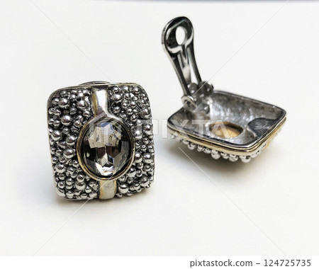 Unique earrings for women on a white background, promotional photo for an online vintage and handmade jewelry store Unique earrings for women on a white background, promotional photo for an online vintage and handmade jewelry store 124725735