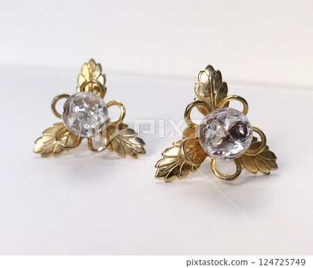 Unique earrings for women on a white background, promotional photo for an online vintage and handmade jewelry store 124725749