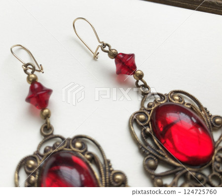 Unique earrings for women on a white background, promotional photo for an online vintage and handmade jewelry store Unique earrings for women on a white background, promotional photo for an online vintage and handmade jewelry store 124725760