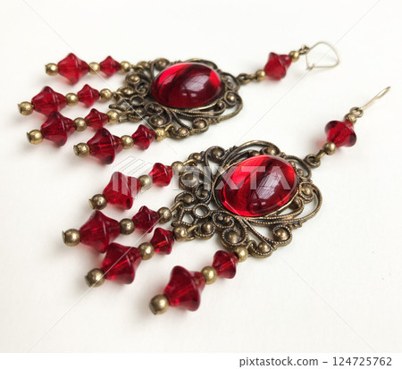 Unique earrings for women on a white background, promotional photo for an online vintage and handmade jewelry store Unique earrings for women on a white background, promotional photo for an online vintage and handmade jewelry store 124725762