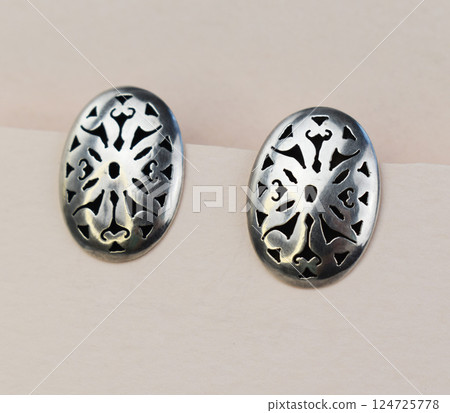 Unique earrings for women on a white background, promotional photo for an online vintage and handmade jewelry store Unique earrings for women on a white background, promotional photo for an online vintage and handmade jewelry store 124725778