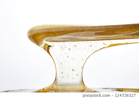 Photo of a sugar paste for depilation hair removal procedure. Texture. 124726327