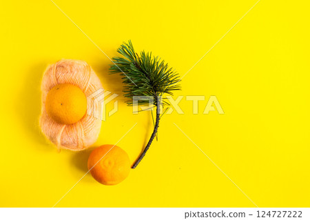 Christmas background with fir tree branches and tangerines. Merry Christmas and Happy New Year Christmas background with fir tree branches and tangerines. Merry Christmas and Happy New Year 124727222