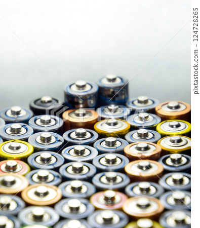 Salt and alkaline batteries, source of energy for portable technology. AAA and AA batteries 124728265