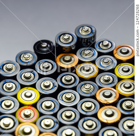 Salt and alkaline batteries, source of energy for portable technology. AAA and AA batteries Salt and alkaline batteries, source of energy for portable technology. AAA and AA batteries 124728268