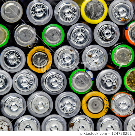 Salt and alkaline batteries, source of energy for portable technology. AAA and AA batteries 124728291