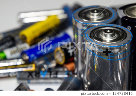 Salt and alkaline batteries, source of energy for portable technology. AAA and AA batteries Salt and alkaline batteries, source of energy for portable technology. AAA and AA batteries 124728415
