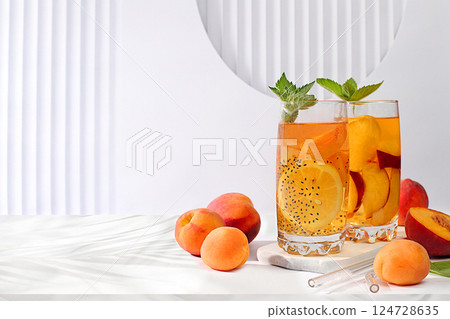 Diet vegan cocktail with chia seeds, lime, lemon, mint and apricots. Detox diet and weight loss concept, summer party and healthy lifestyle advertising. Menu for cafe and restaurant. Diet vegan cocktail with chia seeds, lime, lemon, mint and apricots. Detox diet and weight loss concept, summer party and healthy lifestyle advertising. Menu for cafe and restaurant. 124728635