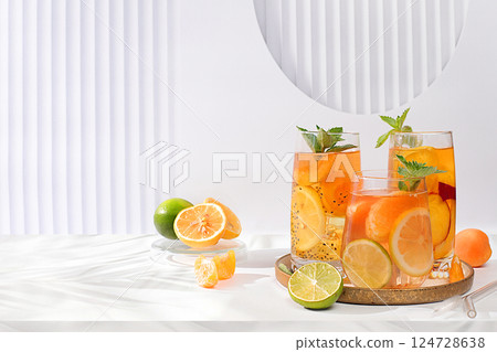 Diet vegan cocktail with chia seeds, lime, lemon, mint and apricots. Detox diet and weight loss concept, summer party and healthy lifestyle advertising. Menu for cafe and restaurant. Diet vegan cocktail with chia seeds, lime, lemon, mint and apricots. Detox diet and weight loss concept, summer party and healthy lifestyle advertising. Menu for cafe and restaurant. 124728638