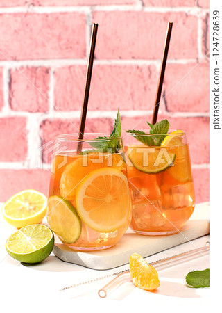 Tropical diet vegan cocktail with chia seeds, lime, lemon, mint and apricots. Detox diet and weight loss concept, summer party and healthy lifestyle advertising. Menu for cafe and restaurant. Tropical diet vegan cocktail with chia seeds, lime, lemon, mint and apricots. Detox diet and weight loss concept, summer party and healthy lifestyle advertising. Menu for cafe and restaurant. 124728639