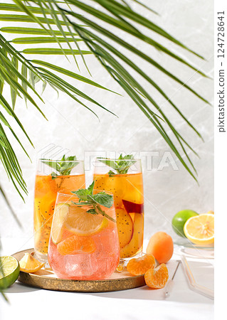 Tropical diet vegan cocktail with chia seeds, lime, lemon, mint and apricots. Detox diet and weight loss concept, summer party and healthy lifestyle advertising. Menu for cafe and restaurant. 124728641