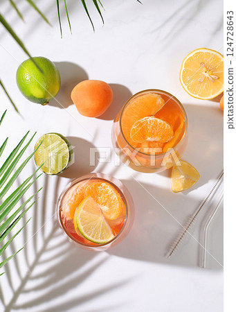 Summer party and healthy lifestyle advertising banner, diet vegan cocktail with chia seeds, lime, lemon, mint and apricots. Detox diet and weight loss concept, Menu for cafe and restaurant. 124728643