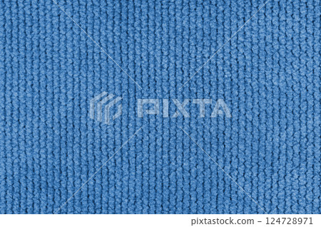 Texture of velour jacquard blue fabric close up, macro. Cloth structure, textile background 124728971