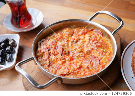 Turkish Menemen omelet in a frying pan. . 124729366