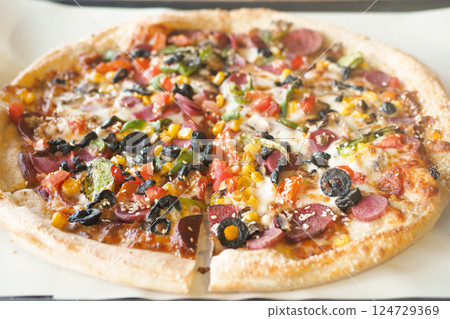 Enjoy a mouthwatering Pepperoni and Veggie Pizza topped with vibrant Colorful Toppings Enjoy a mouthwatering Pepperoni and Veggie Pizza topped with vibrant Colorful Toppings 124729369