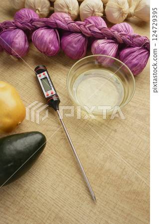 Using Fresh Ingredients for Cooking with a Kitchen Thermometer and Quality Olive Oil 124729395