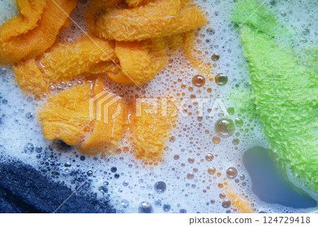 A vibrant and colorful display of soap foam featuring fun bubbles and mesmerizing swirls A vibrant and colorful display of soap foam featuring fun bubbles and mesmerizing swirls 124729418