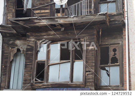An Abandoned Building Featuring Broken Windows and Weathered Wood in a Derelict State An Abandoned Building Featuring Broken Windows and Weathered Wood in a Derelict State 124729552