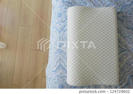 Orthopedic pillow on a bed Orthopedic pillow on a bed 124729602