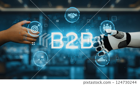 Business to Business Interaction with Robotic Hand and Human Hand Representing Collaboration and Technology in Modern Industry. Auvana Business to Business Interaction with Robotic Hand and Human Hand Representing Collaboration and Technology in Modern Industry. Auvana 124730244