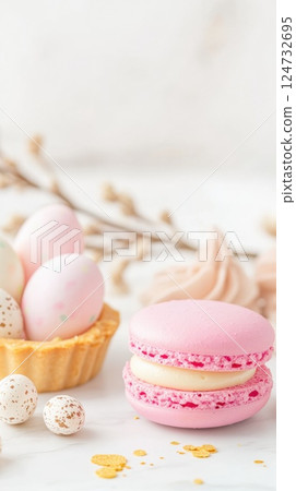 Delicate pastel dessert arrangement featuring lemon tart, pink macaron, and vanilla cupcake with Easter details Delicate pastel dessert arrangement featuring lemon tart, pink macaron, and vanilla cupcake with Easter details 124732695