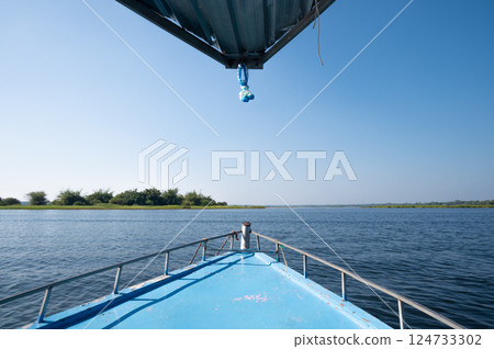View of Bueng Khong Long the largest frehwater reservoir in Bueng Kan province of Thailand seen from tourist boat. View of Bueng Khong Long the largest frehwater reservoir in Bueng Kan province of Thailand seen from tourist boat. 124733302