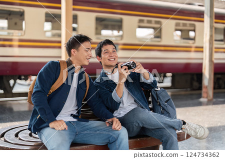 Travel and Connection. Friends enjoying a conversation and capturing the moment. Travel and Connection. Friends enjoying a conversation and capturing the moment. 124734362