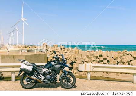 Windmills and bikes lined up along the coastline Windmills and bikes lined up along the coastline 124734704