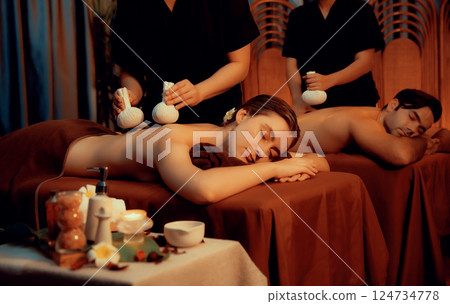 Hot herbal ball spa massage body treatment with couple customer. Quiescent Hot herbal ball spa massage body treatment with couple customer. Quiescent 124734778