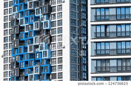 Building with modern design. Tall multistory condominium in metropolitan neighborhood, downtown 124736623