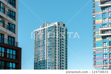 Building with modern architecture. Tall condominium with window facade and multi story design in 124736633