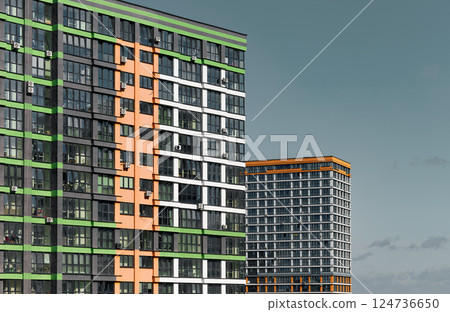 Building in metropolitan city. Tall modern highrise block with condominium and housing, real estate 124736650