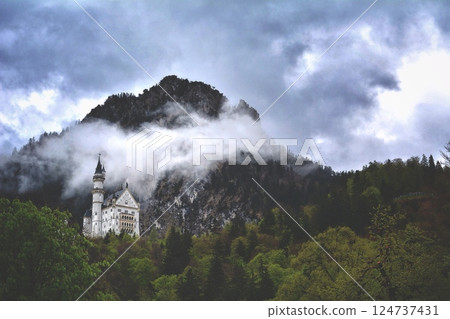 Schwanenstein. Wide view of an castle in the mountains with clouds and a analog feeling.room for copy space. Schwanenstein. Wide view of an castle in the mountains with clouds and a analog feeling.room for copy space. 124737431