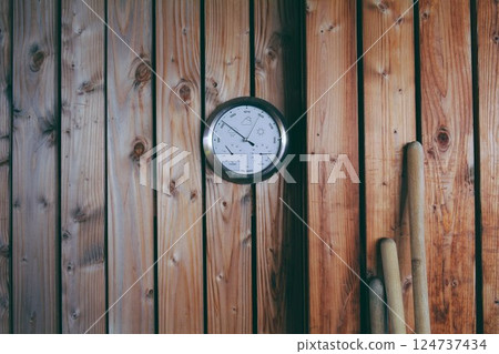 Clock on wooden background.Analog feeling. 124737434