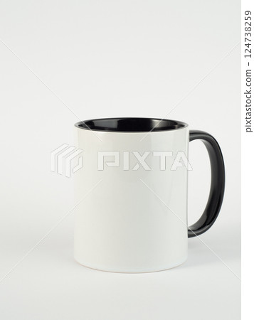 Two-tone 11oz mug on isolated background. Mug with black handle and inner part. Two-tone 11oz mug on isolated background. Mug with black handle and inner part. 124738259