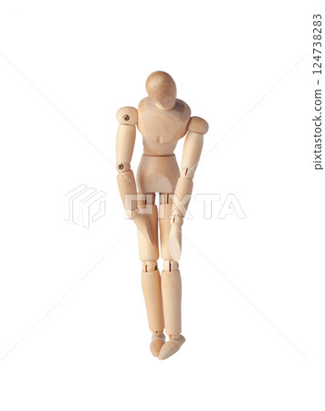 A Wooden dummy with hands down, conveying sadness. A Poseable figure and Articulated mannequin capture a moment of despair, perfect for artists and creating expressive, emotional sketches. A Wooden dummy with hands down, conveying sadness. A Poseable figure and Articulated mannequin capture a moment of despair, perfect for artists and creating expressive, emotional sketches. 124738283