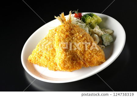 Fried horse mackerel photographed against a black background 124738319