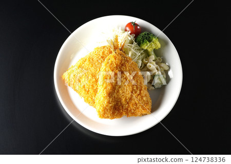 Fried horse mackerel photographed against a black background 124738336