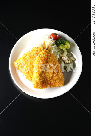 Fried horse mackerel photographed against a black background 124738339