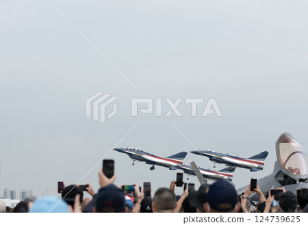 Faceless people get to see the military's fighter jets Faceless people get to see the military's fighter jets 124739625