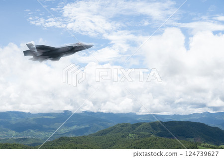 Fighter jet flies through the sky on technology background 124739627