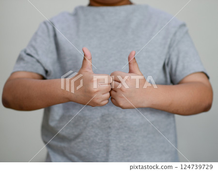 Child's hand thumb up is a symbol Child's hand thumb up is a symbol 124739729
