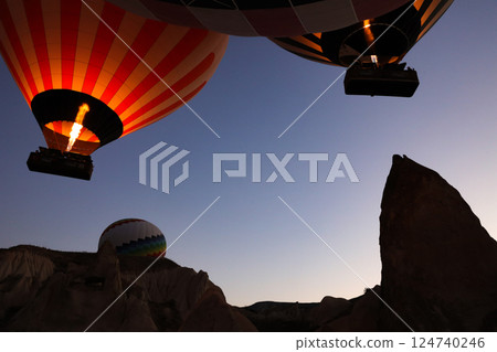 Balloons floating in the dawn sky over Cappadocia 124740246